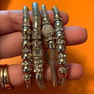 Set of 4 gold stretch bracelets WHBM
